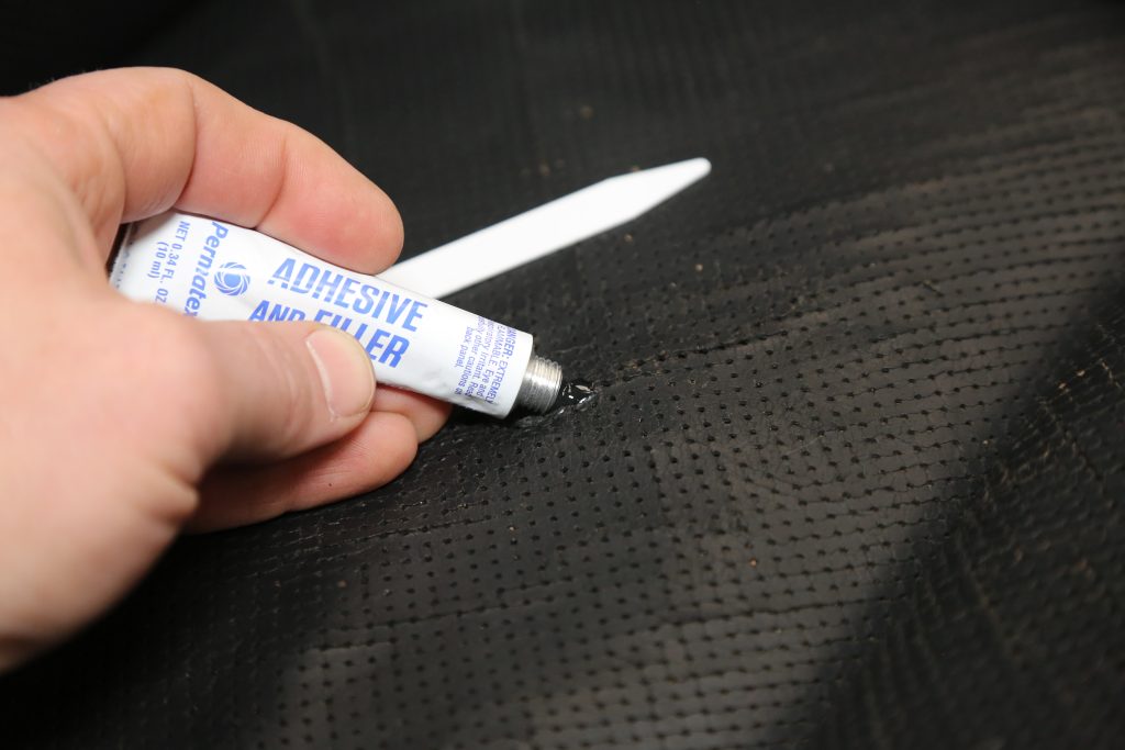 gluing a car seat tear together