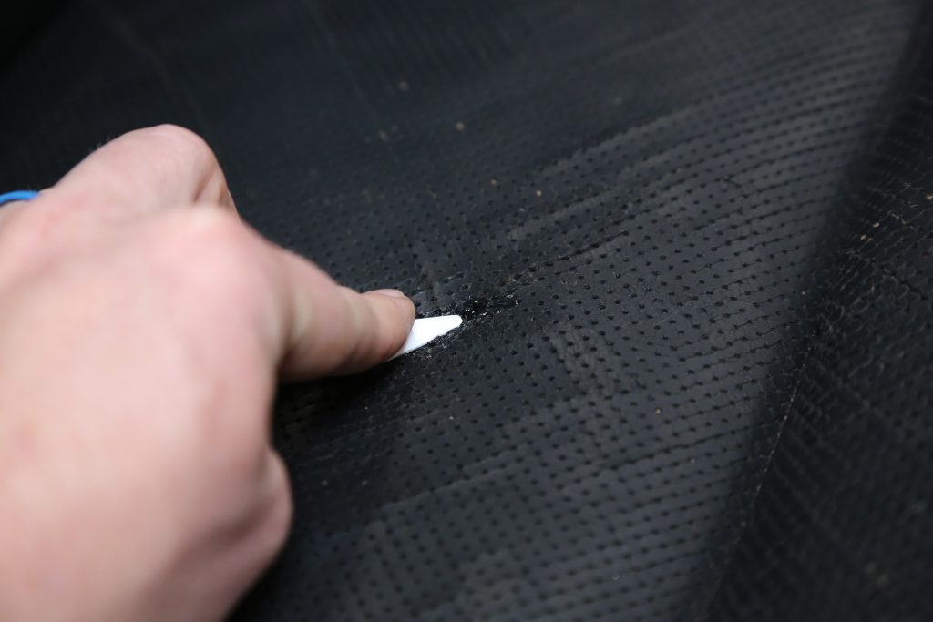 gluing a hole together in a car seat