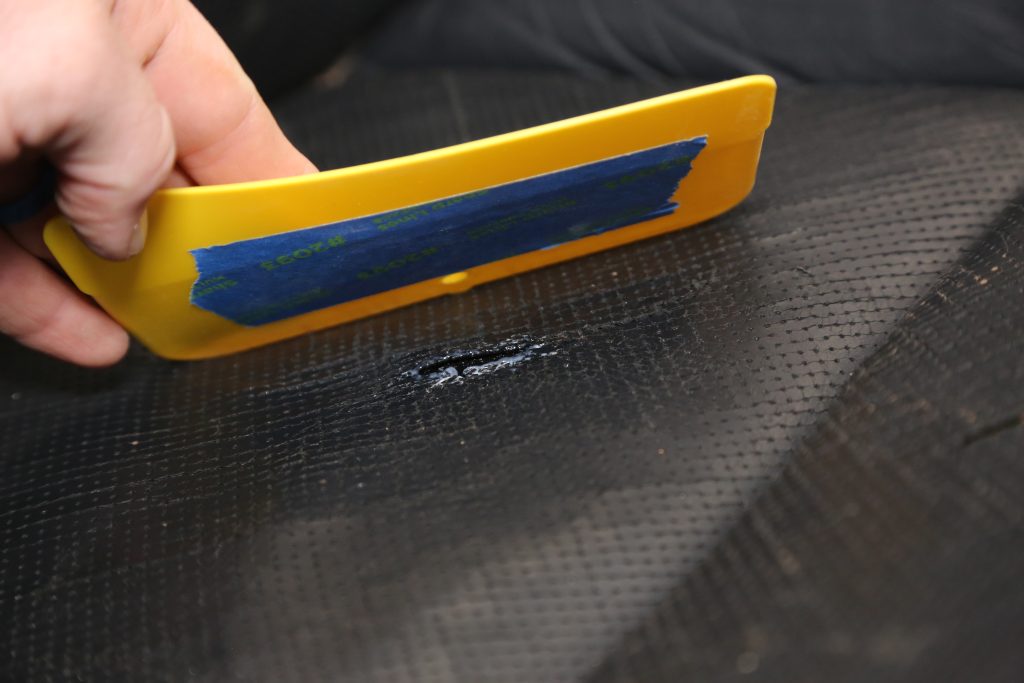 dressing a glue spot in a car seat