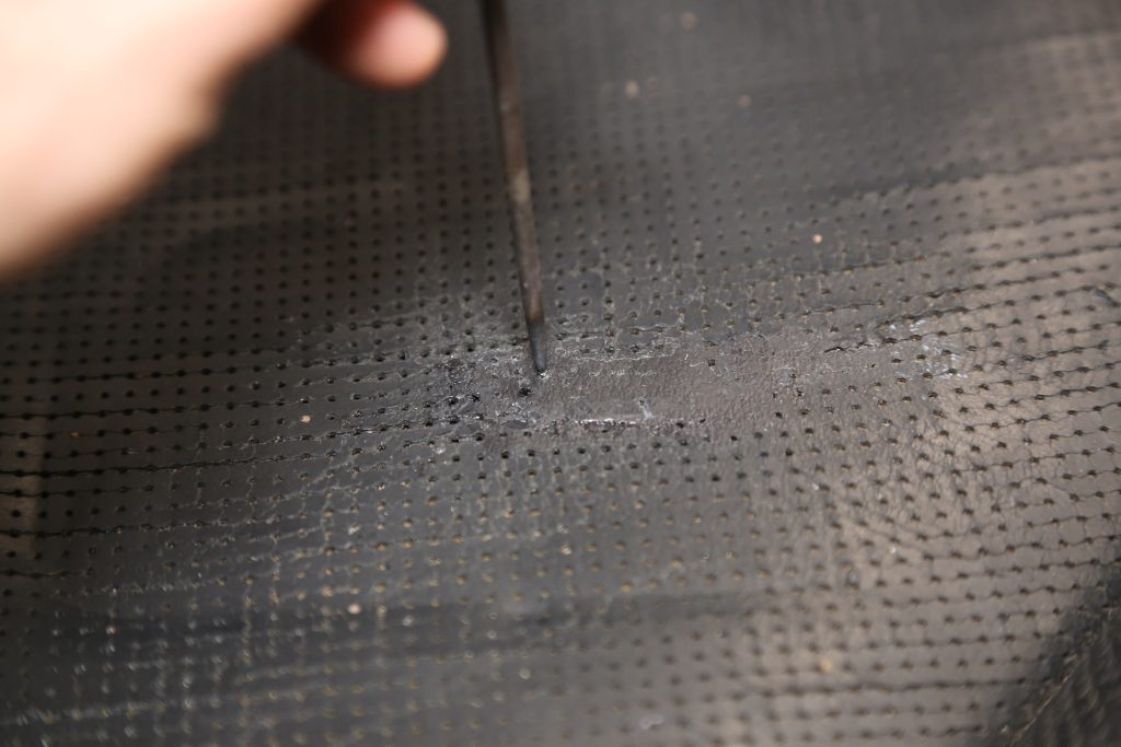 poking holes in a car seat patch
