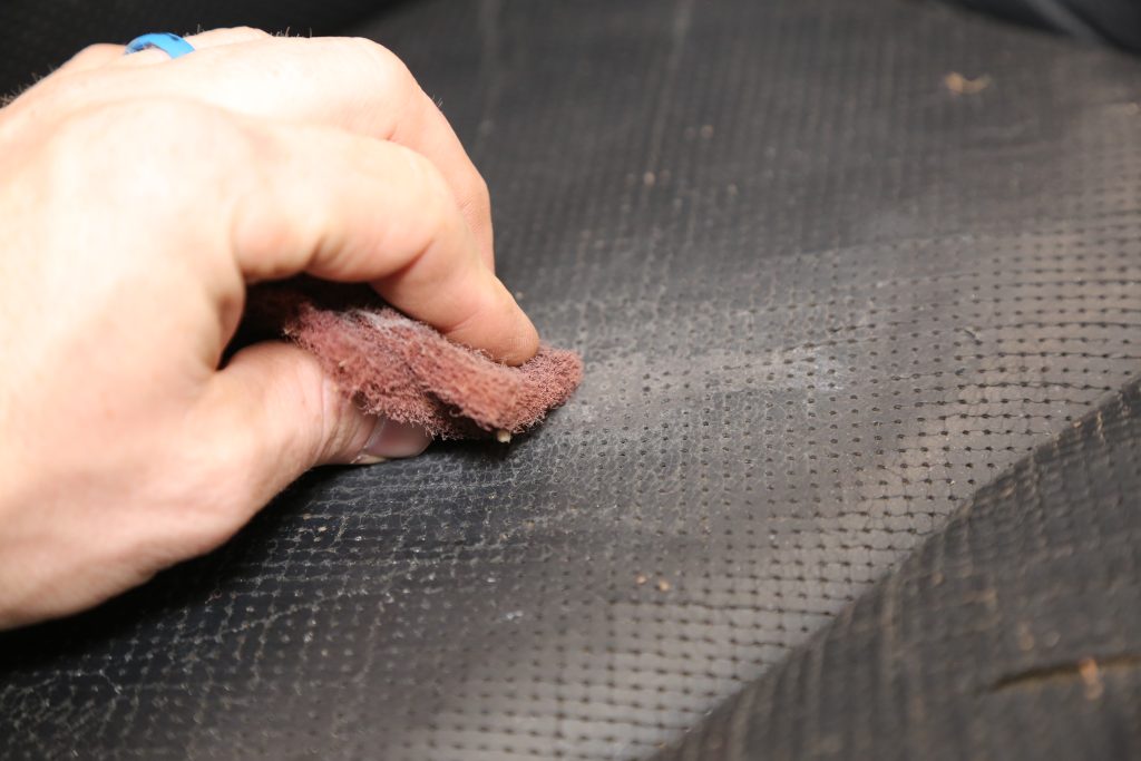 using a scotch brite pad on a car seat repair