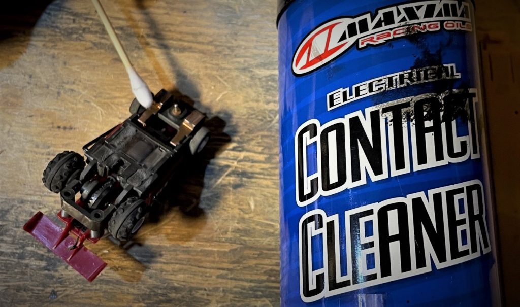 cleaning bottom of a slot car with contact cleaner