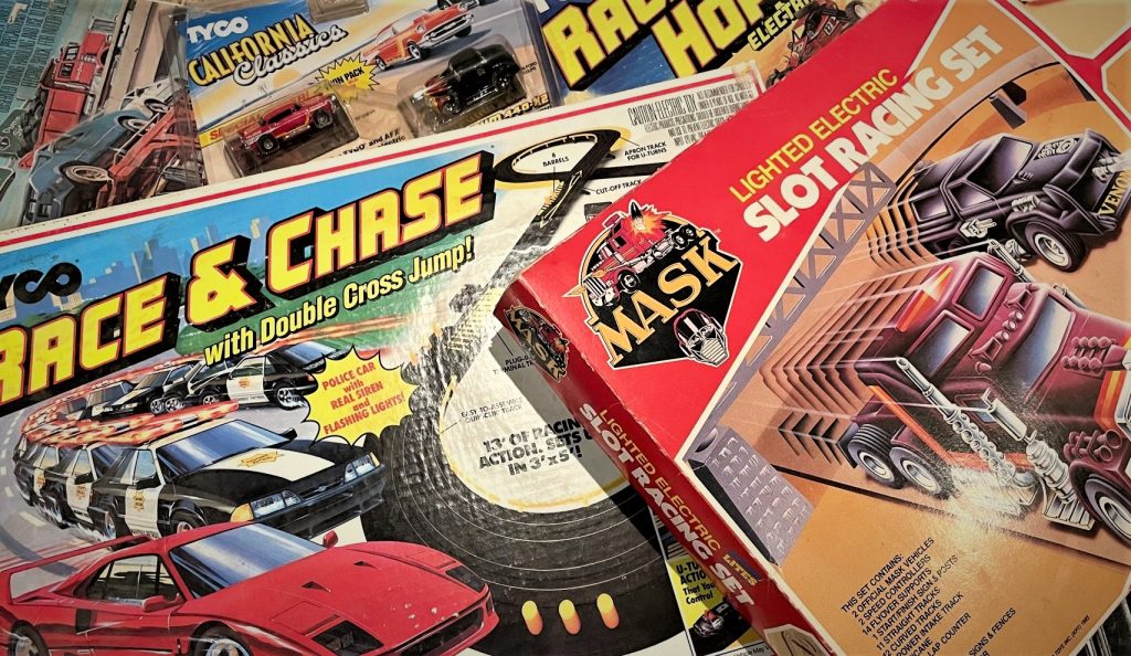 vintage slot car boxes arranged on floor