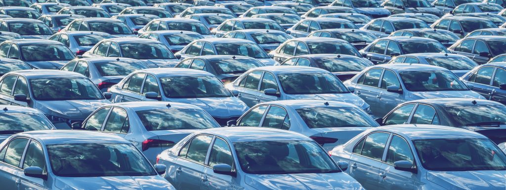 Rows of a new cars parked in a parking lot