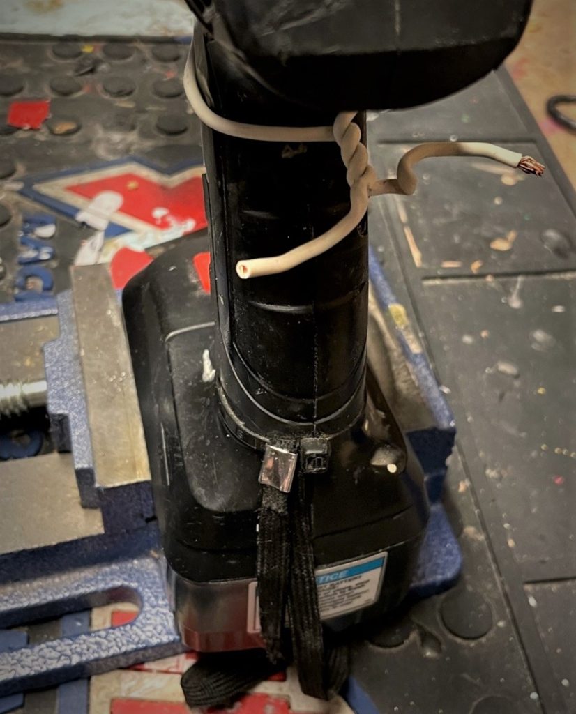 wire wrapped around drill tumbler switch handle