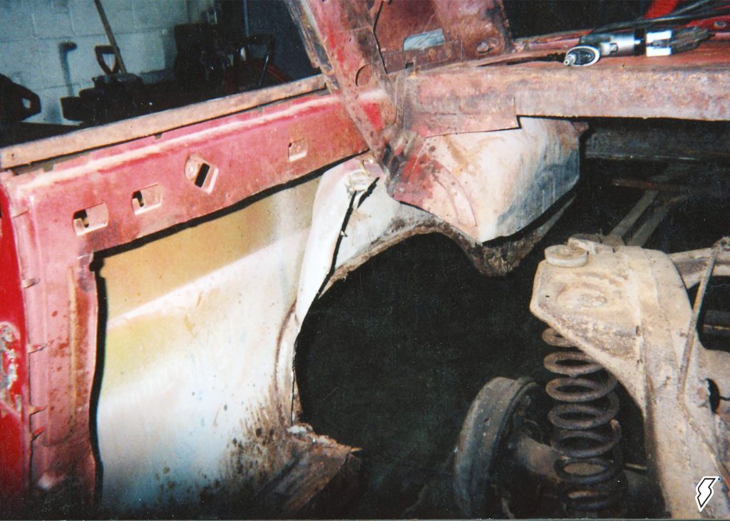 rusted cut inner fender of a 1962 chevy impala restoration project