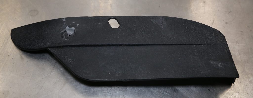 a repaired automotive trim panel