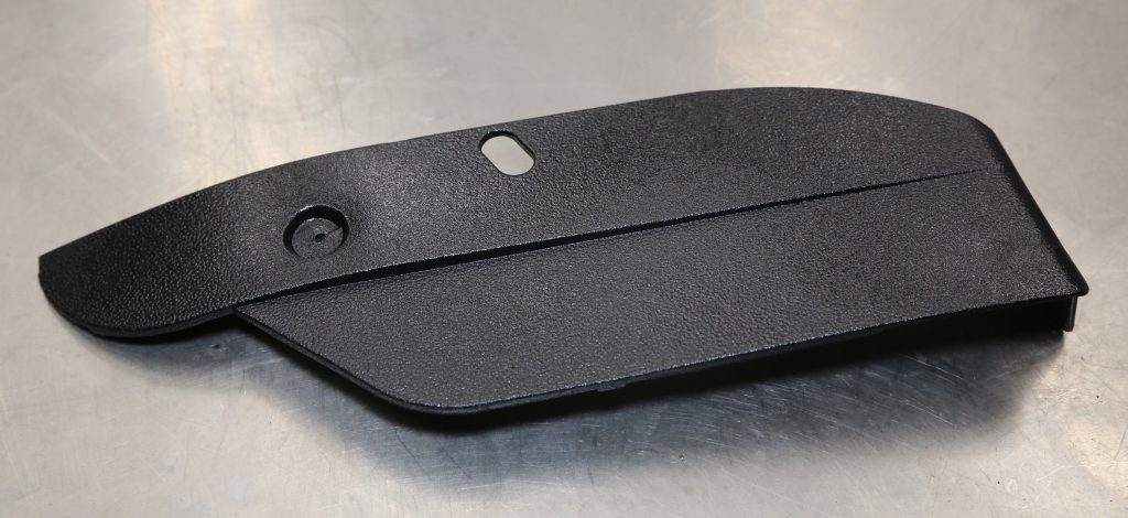 a repaired automotive trim panel