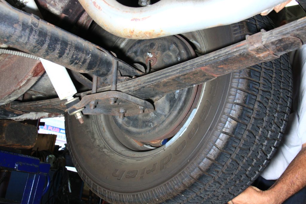 chassis view under rear wheel of vintage mustang