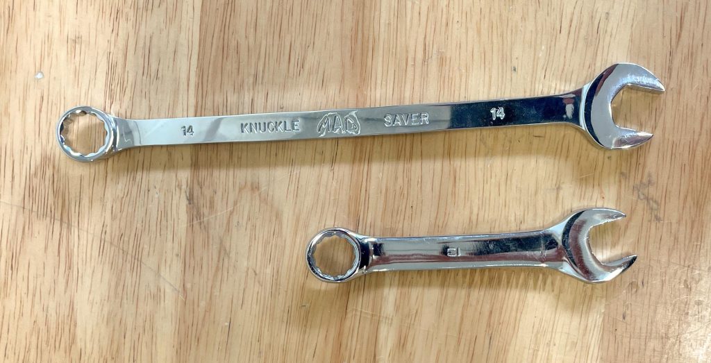 a pair of MAC box end wrenches on a table