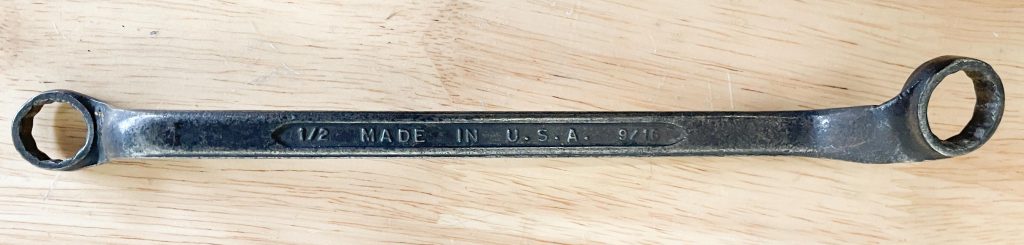 old box wrench on a workbench