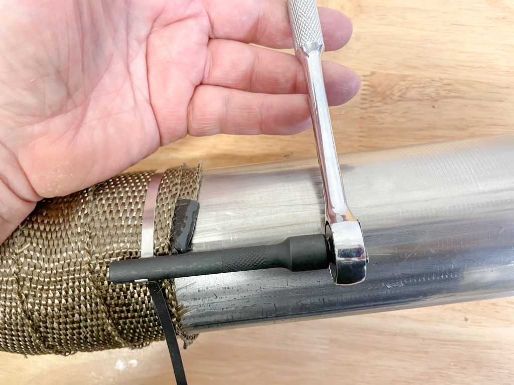tightening stainless steel zip tie on header wrap