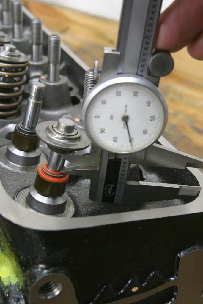 using a dial caliper on a rocker stud
