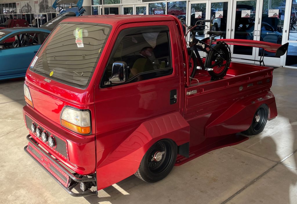modded kei truck with bike in bed