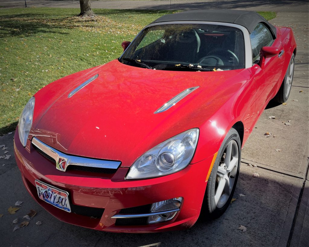 red Saturn Sky in driveway
