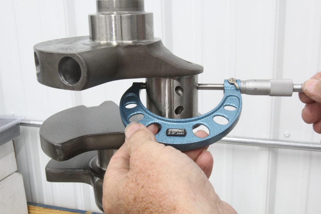 using a micrometer to measure a crankshaft journal