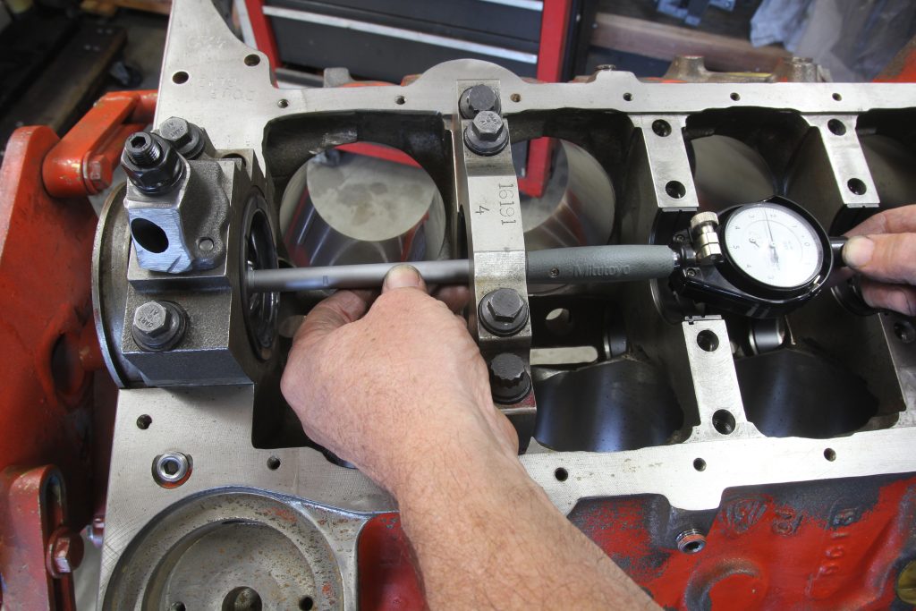 using a dial gauge to measure crankshaft bore