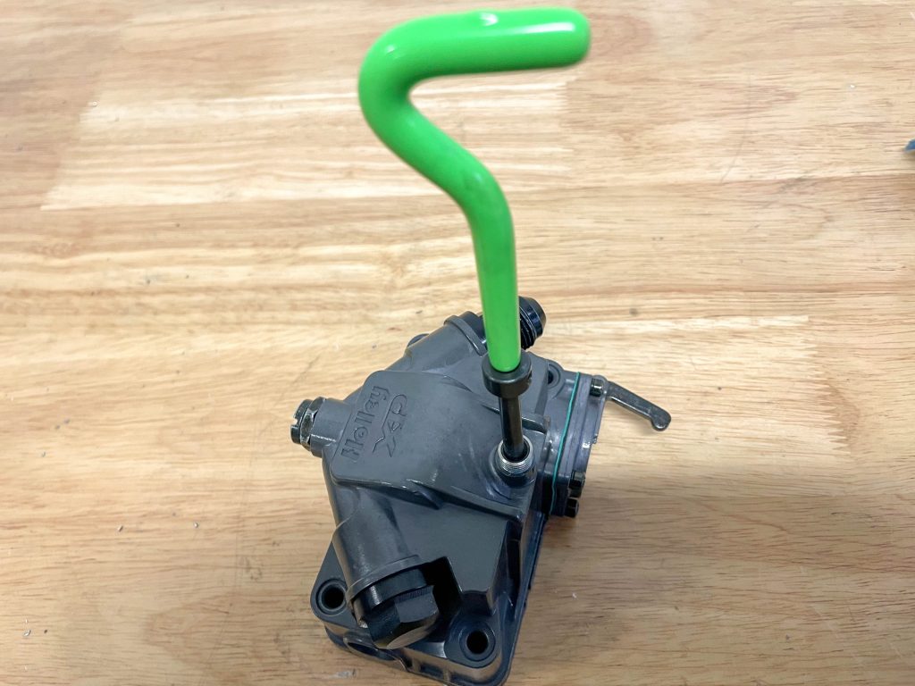 inserting thread repair tool into drilled hole