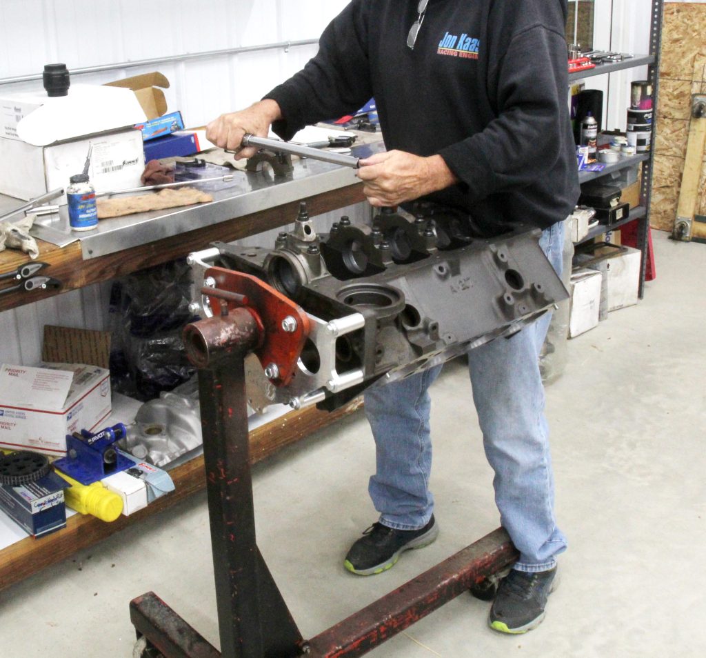 installing main caps on an engine block on a stand