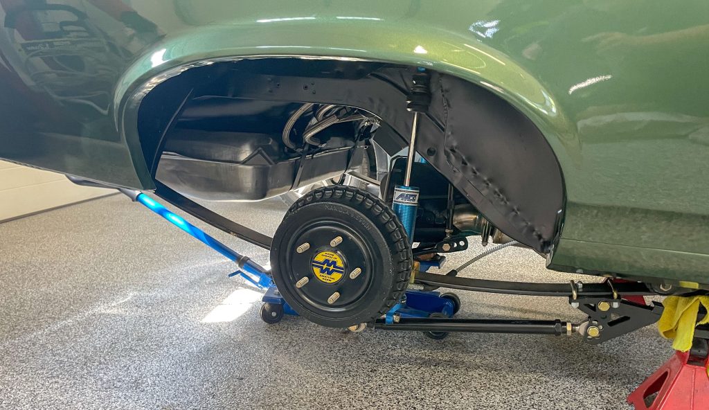 view of a rear drum brake on a vintage muscle car