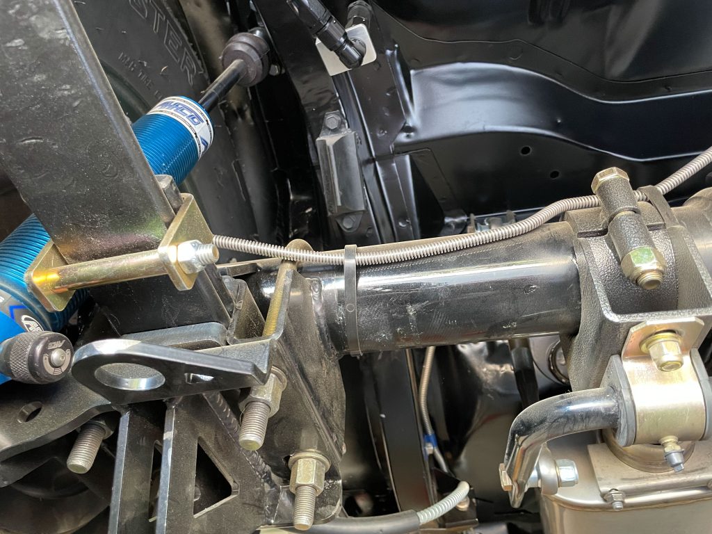 view of axle and spring perch for a vintage muscle car