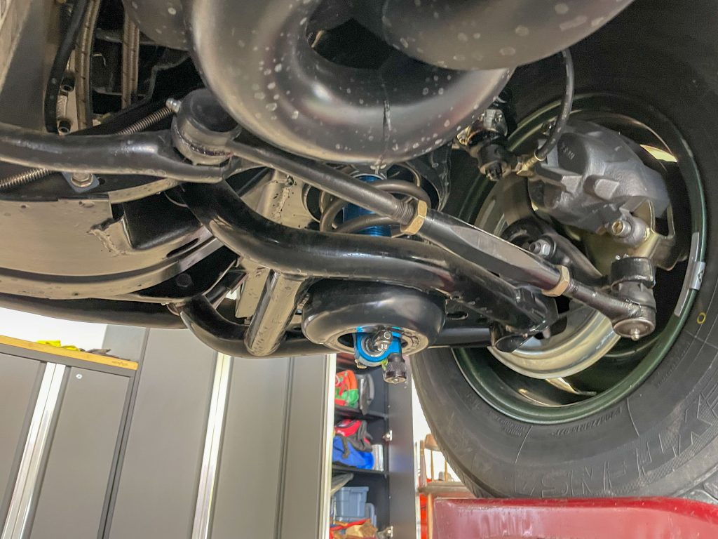 close up of shock adjusting nut on a vintage muscle car