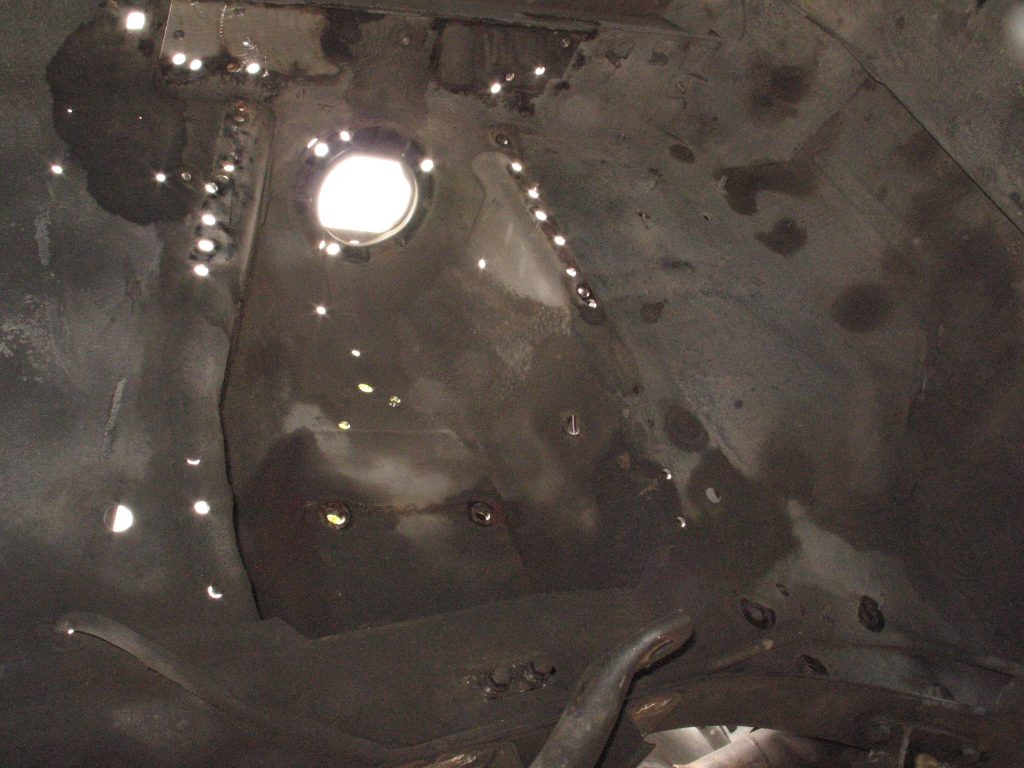 mustang shock tower with welds drilled out