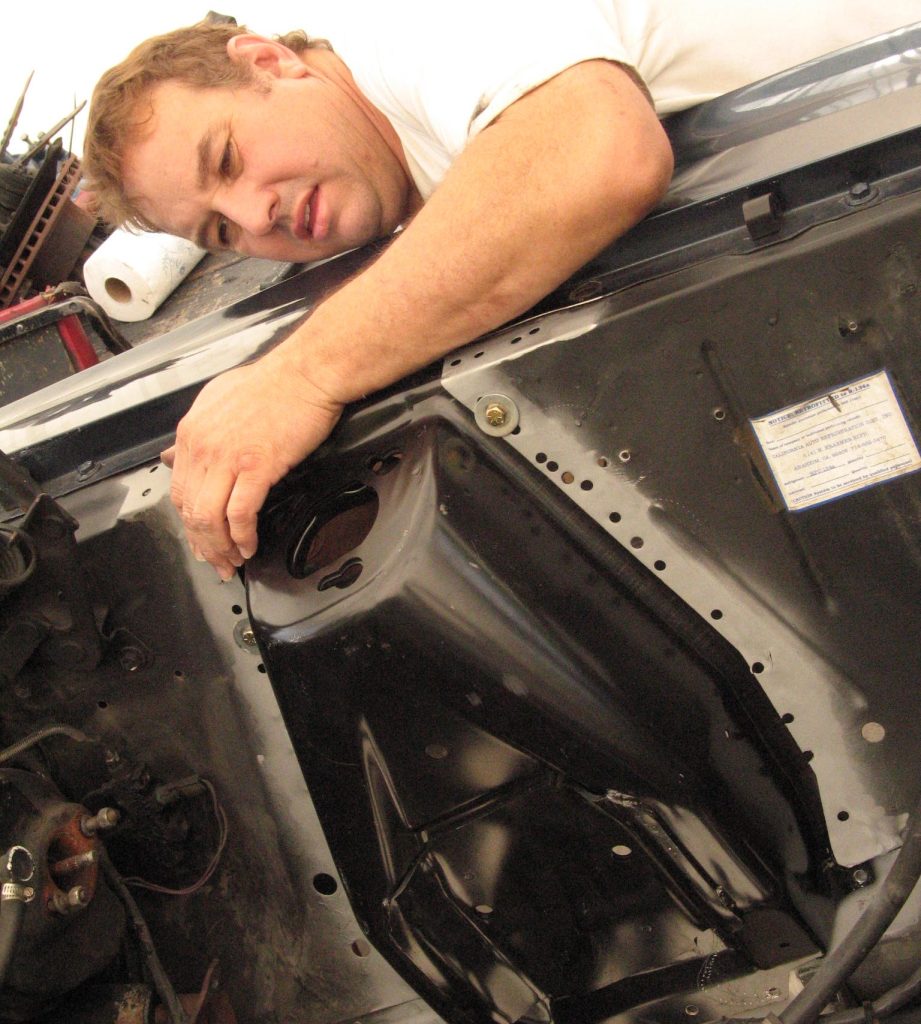 installing a new shock tower in a vintage ford mustang