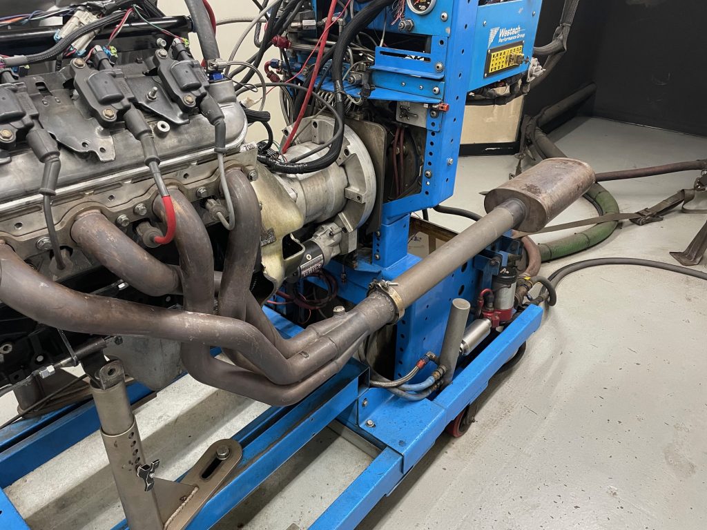 close up of exhaust system on an engine on a dyno