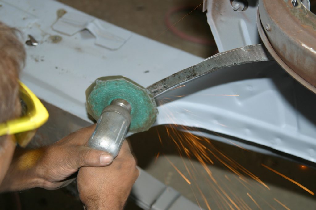 grinding welds flat on an old car body