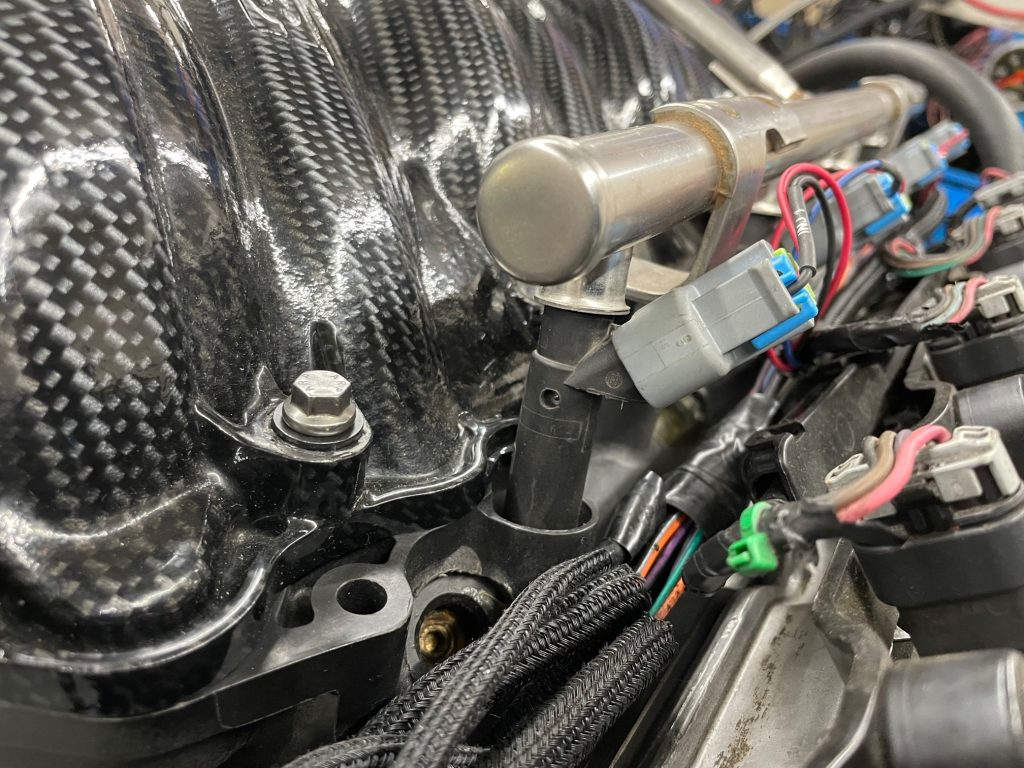 close up of fuel rail on an engine