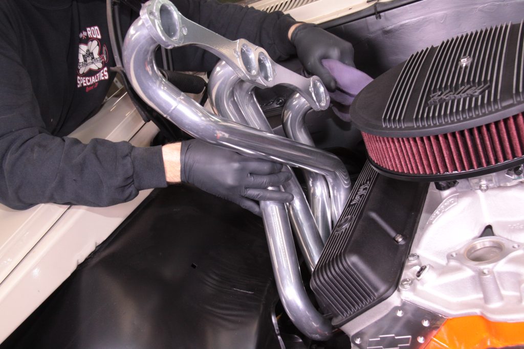 fitting exhaust headers into engine bay of a classic car