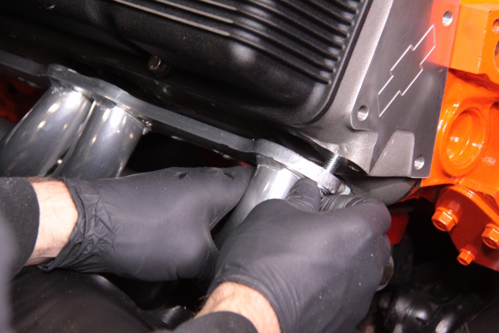 bolting up a set of headers to a v8 chevy engine