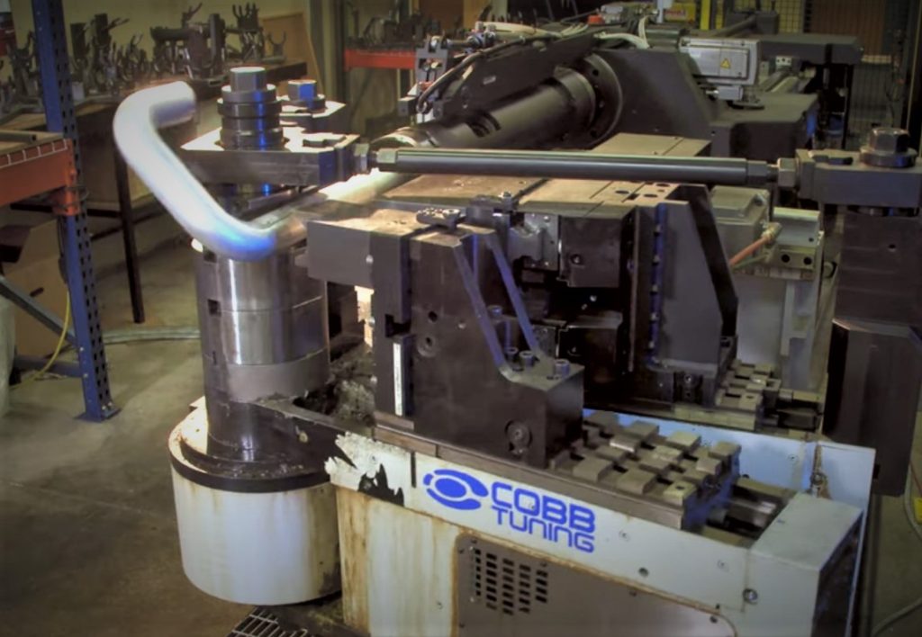tubing being bent on a mandrel machine