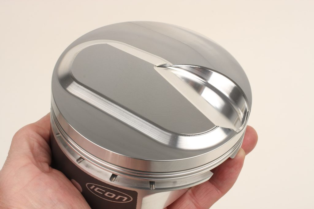 top of a domed piston head with valve relief
