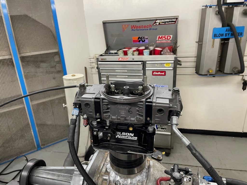 carburetor atop a supercharger blower housing