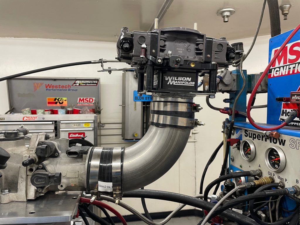 elbow adapter for carburetor on a supercharged engine