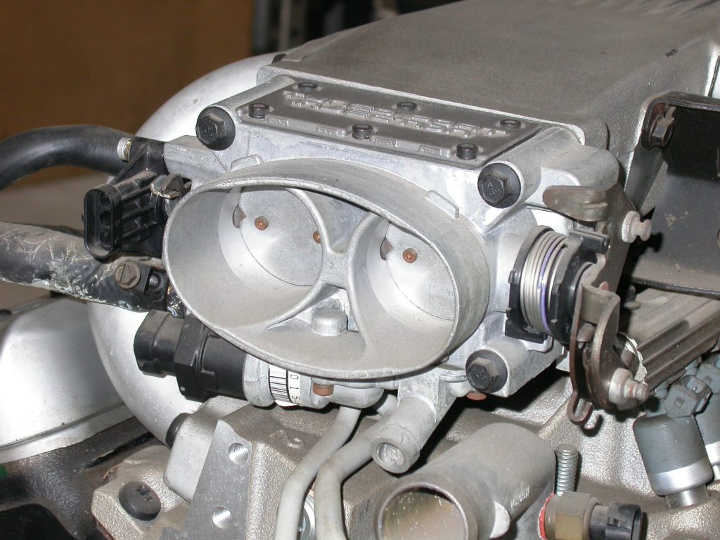 close up of throttle body on TPI Manifold