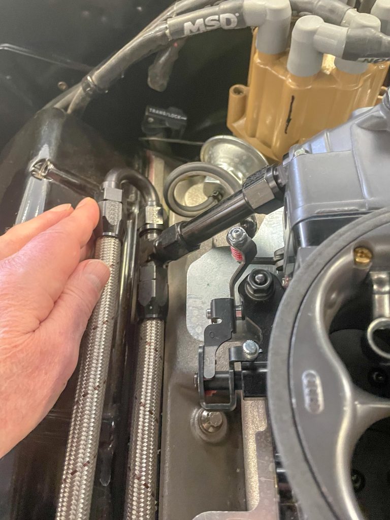 fuel rail for a carburetor system installed