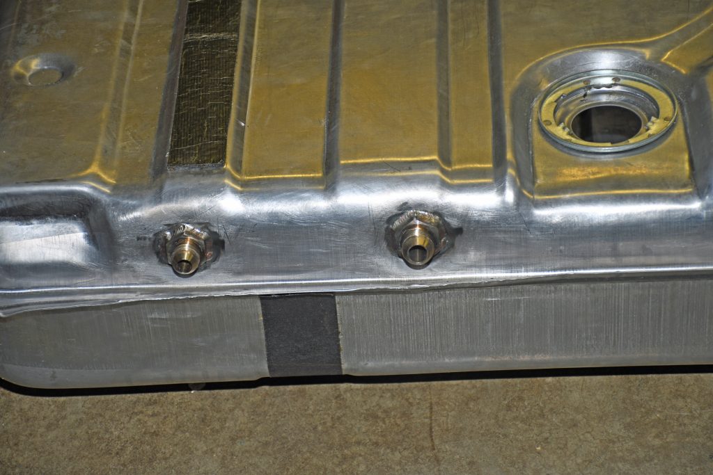 line fittings welded into a new fuel tank