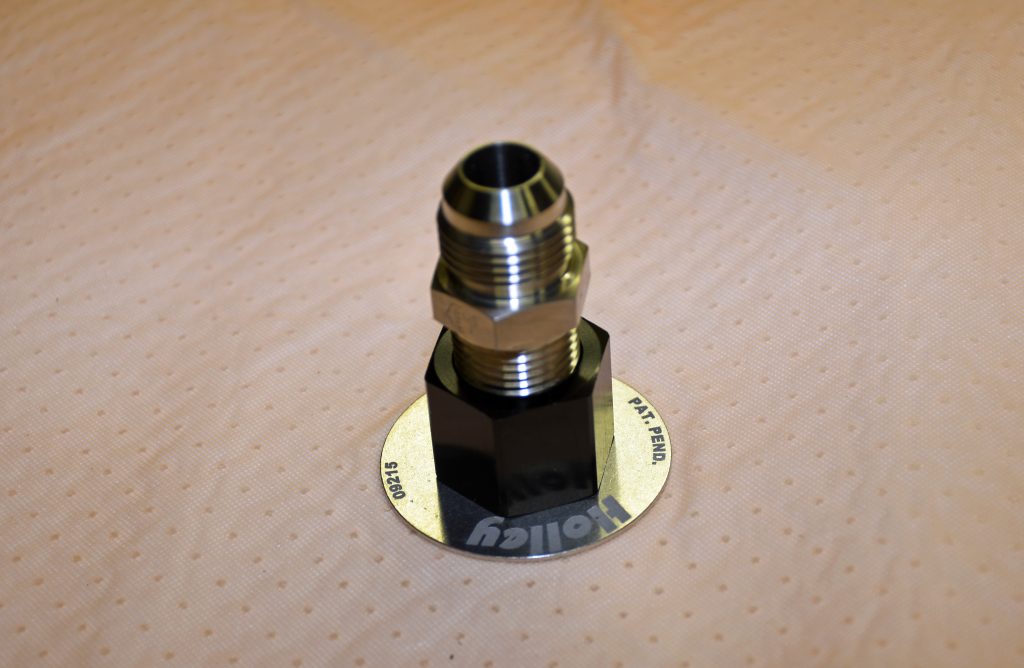 fitting on a fuel tank mat