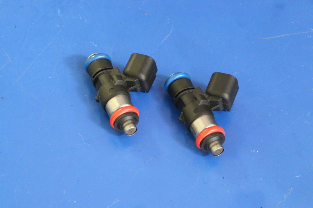 2 fuel injectors on a table