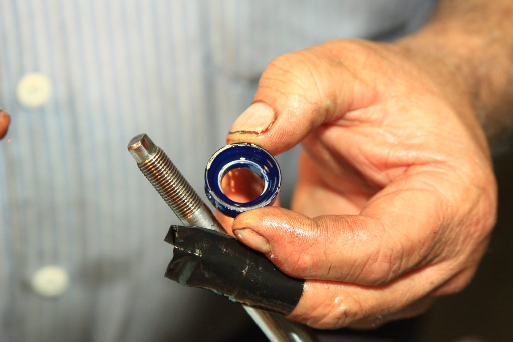 man holding a seal for a hydraulic cylinder