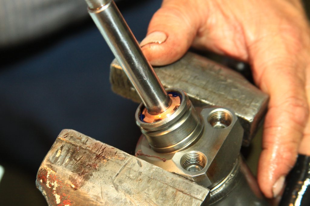 putting a rubber grommet seal into a cylinder