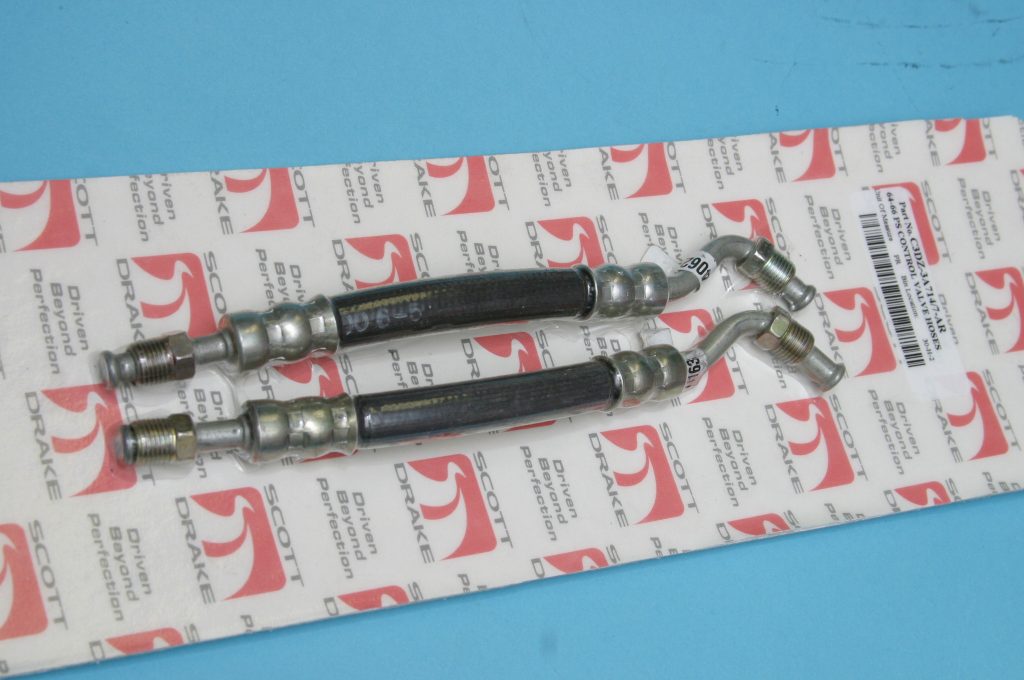 a pair of rubber hoses on a blister card