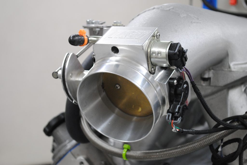 mouth of a FAST throttle body on an ls engine