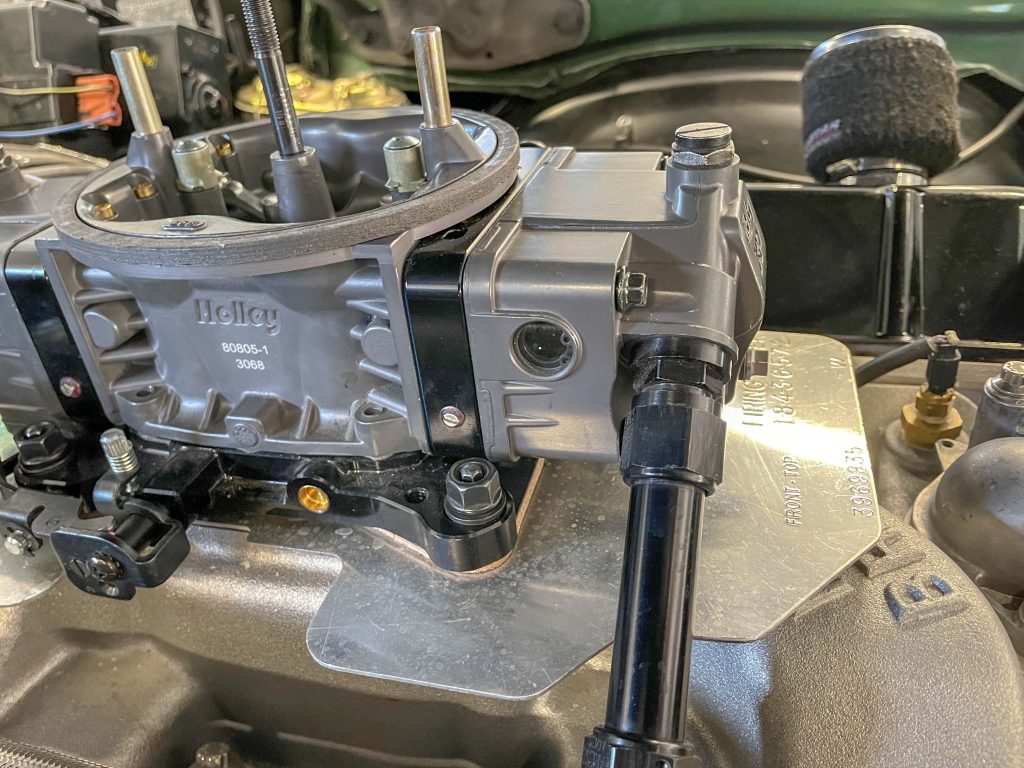 holley carburetor atop an engine