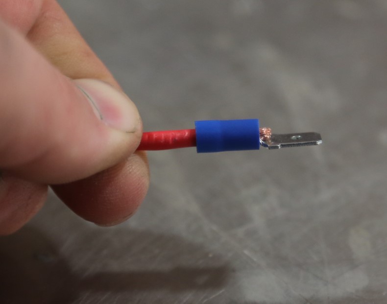 wire with a spade terminal before crimping