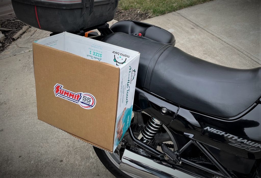motorcycle with cardboard box luggage mockup