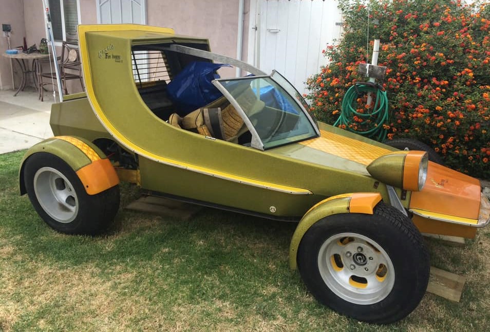 custom george barris show car in someone's backyard